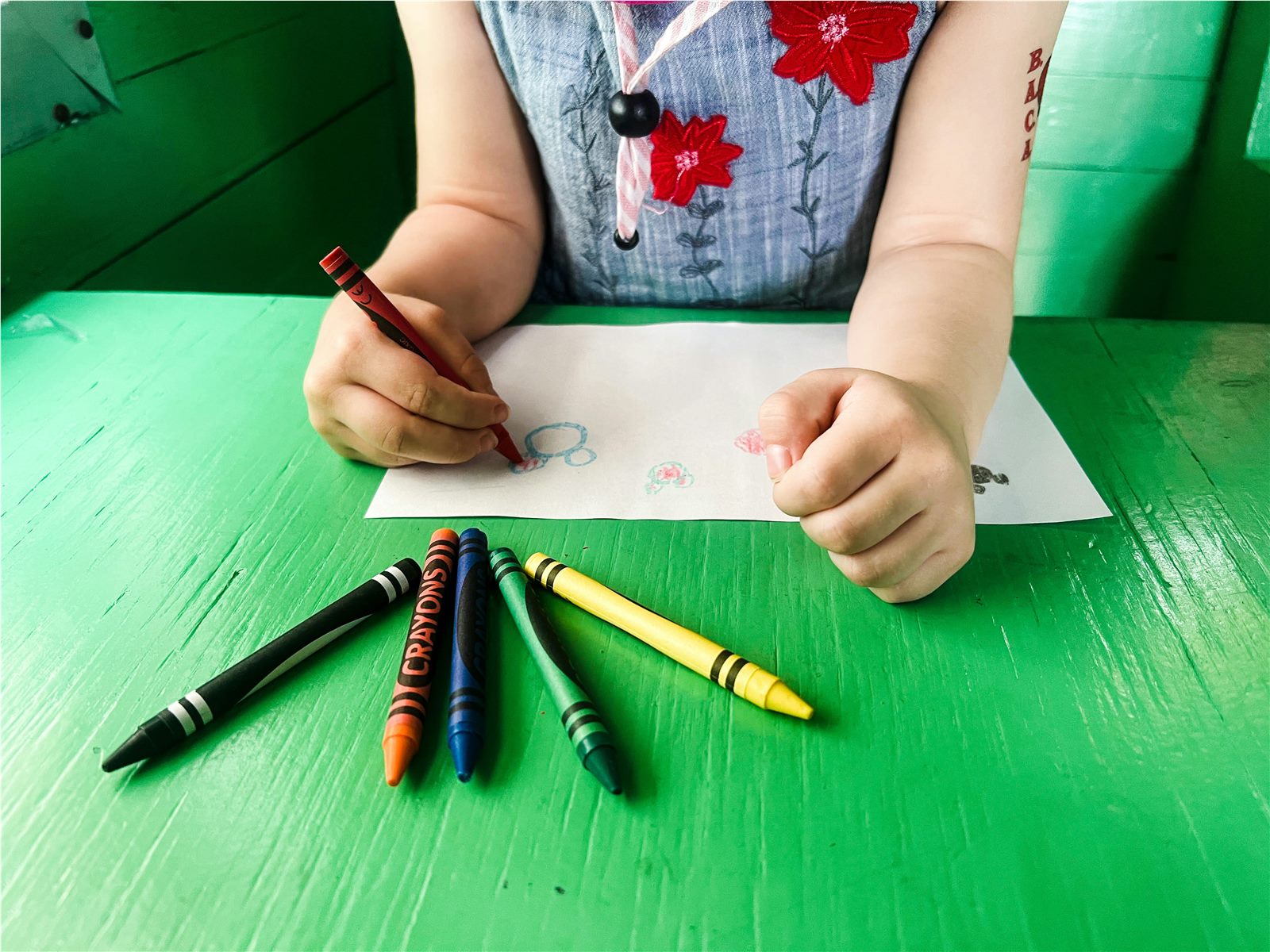 Preschooler doing a hands-on Montessori threading activity in Mississauga